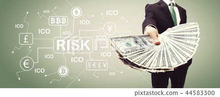Cryptocurrency risk theme with business man with cash 44583300