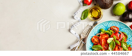Healthy food and tape measure 44584667