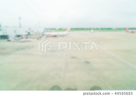 Blur of airplane at airport gate Blur of airplane at airport gate 44585683