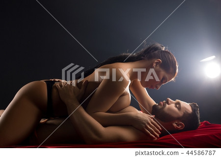 Loving couple embracing in bed shot Loving couple embracing in bed shot 44586787