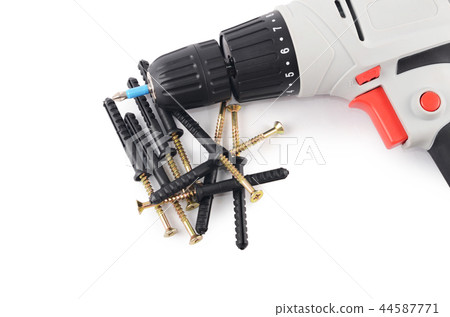 New screwdriver with screws and dowels close-up New screwdriver with screws and dowels close-up 44587771