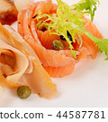 Cutting different fish in the restaurant 44587781
