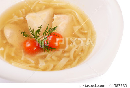 Soup homemade noodles with a chicken close up Soup homemade noodles with a chicken close up 44587783
