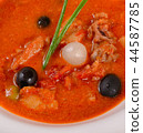 Solyanka soup with olives and onions close up 44587785
