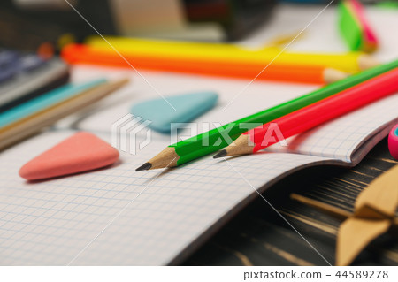 Bright crayons lie on a notebook. Education concepte Bright crayons lie on a notebook. Education concepte 44589278