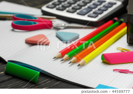 Bright items for a school on a wooden table Bright items for a school on a wooden table 44589777