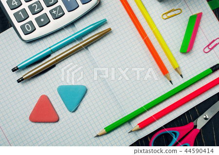 In the notebook are pens, pencils and calculator 44590414