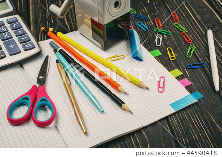 Bright items for a school on a wooden table 44590418