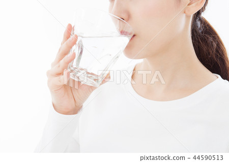 Young woman drinking water Young woman drinking water 44590513