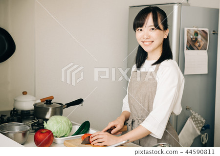 Young Housewife Cutting Japanese Food In Kitchen Stock Photo 44590811 Pixta