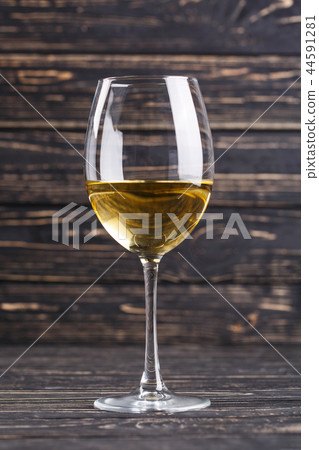 A glass of white semi-dry dessert wine 44591281