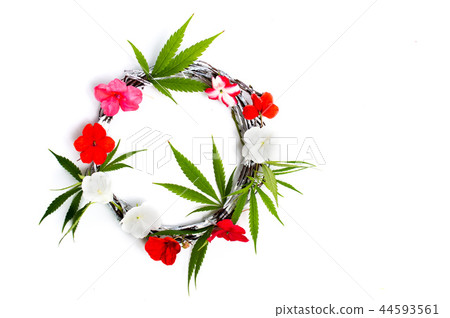 Cannabis and flower arrangement on white Cannabis and flower arrangement on white 44593561