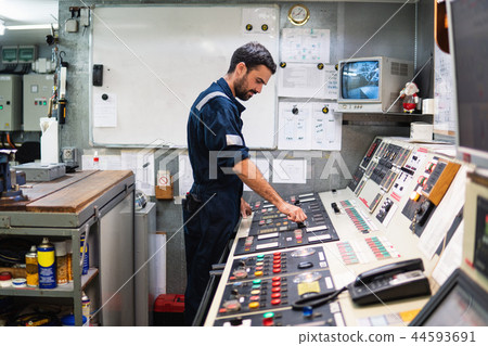 Marine engineer officer working in engine room Marine engineer officer working in engine room 44593691