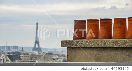 The roofs of Paris and its chimneys under a clouds sky The roofs of Paris and its chimneys under a clouds sky 44595145