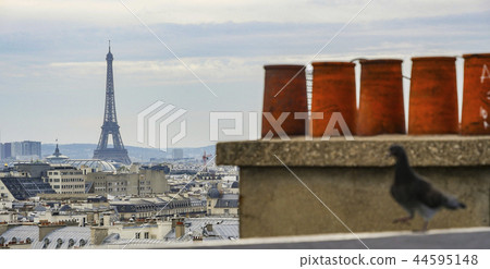 The roofs of Paris and its chimneys under a clouds sky The roofs of Paris and its chimneys under a clouds sky 44595148