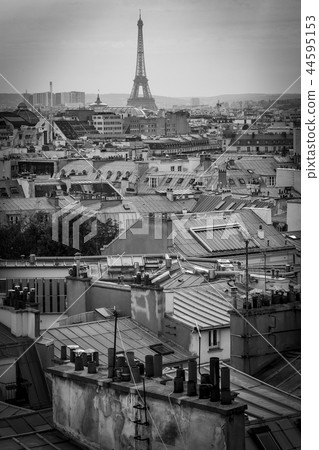 The roofs of Paris and its chimneys under a clouds sky The roofs of Paris and its chimneys under a clouds sky 44595153