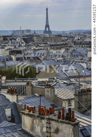 The roofs of Paris and its chimneys under a clouds sky The roofs of Paris and its chimneys under a clouds sky 44595157