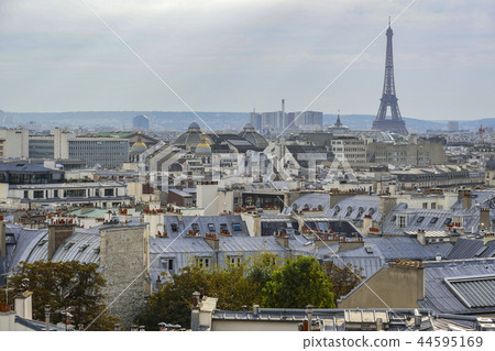 The roofs of Paris and its chimneys under a clouds sky The roofs of Paris and its chimneys under a clouds sky 44595169