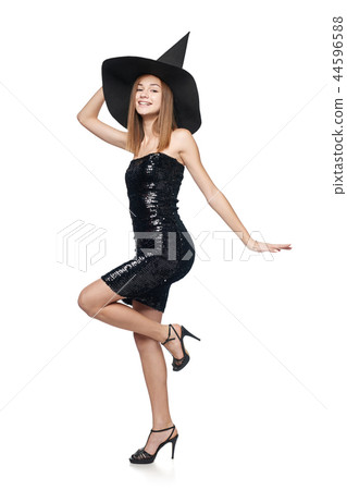 Full length playful Halloween witch on white background 44596588