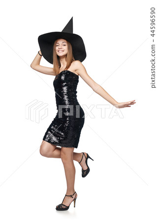 Full length playful Halloween witch on white background Full length playful Halloween witch on white background 44596590