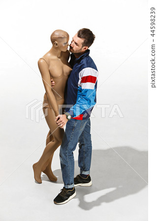 Fashion woman body. The man hugging mannequin, perfect woman dream concept 44598239