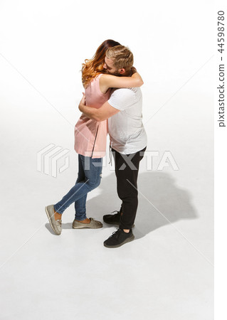 Full body portrait of hugging couple with smile. Caucasian models in love Full body portrait of hugging couple with smile. Caucasian models in love 44598780