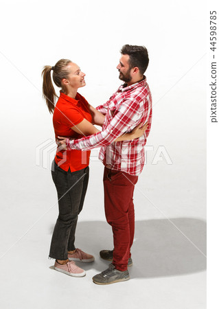 Full body portrait of hugging couple with smile. Caucasian models in love 44598785