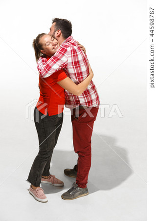 Full body portrait of hugging couple with smile. Caucasian models in love 44598787