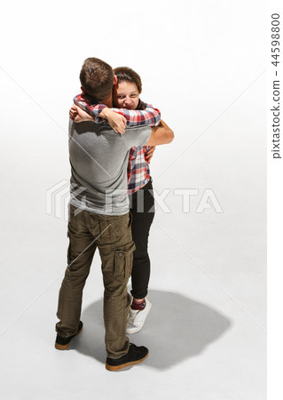 Full body portrait of hugging couple with smile. Caucasian models in love 44598800
