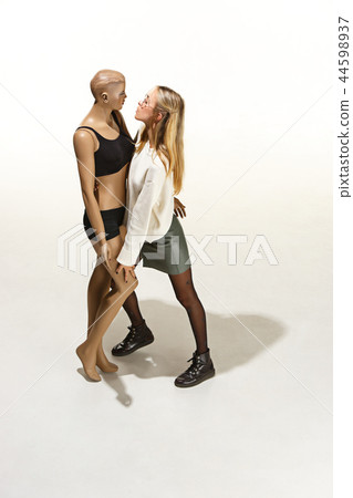 Fashion woman body. The woman hugging mannequin, perfect woman dream concept Fashion woman body. The woman hugging mannequin, perfect woman dream concept 44598937