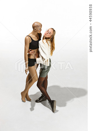 Fashion woman body. The woman hugging mannequin, perfect woman dream concept Fashion woman body. The woman hugging mannequin, perfect woman dream concept 44598938