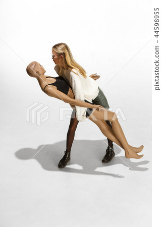 Fashion woman body. The woman hugging mannequin, perfect woman dream concept Fashion woman body. The woman hugging mannequin, perfect woman dream concept 44598955