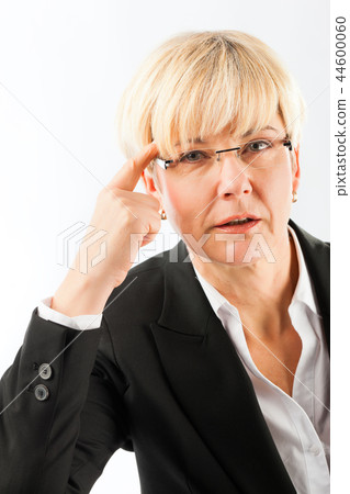 Thoughtful mature businesswoman with eyeglasses 44600060