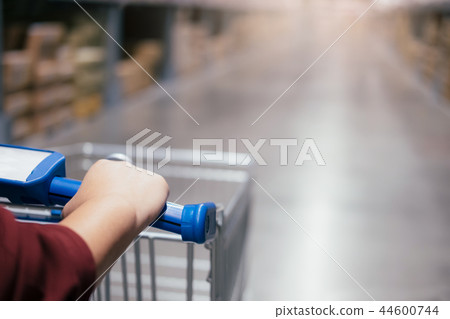 Man using trolley cart. Man using trolley cart. 44600744