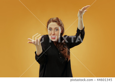 Beautiful female half-length portrait isolated on studio backgroud. The young emotional surprised Beautiful female half-length portrait isolated on studio backgroud. The young emotional surprised 44601345