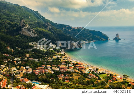 Beautiful beach and boats. Clean sea with a bay.  44602118
