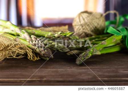 Fresh green asparagus spear with curtains Fresh green asparagus spear with curtains 44605887