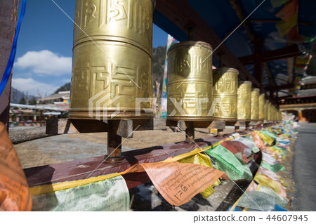 Buddhist prayer wheels in a Tibetan monastery Buddhist prayer wheels in a Tibetan monastery 44607945