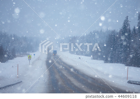 snow and fog on the winter road landscape / view of the seasonal weather a dangerous road, a winter lonely landscape 44609118