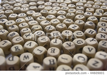 cubes beads letters alphabet / background of wooden cubes with alphabet letters, concept education reading, learning letters 44609801