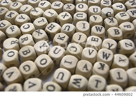 cubes beads letters alphabet / background of wooden cubes with alphabet letters, concept education reading, learning letters 44609802