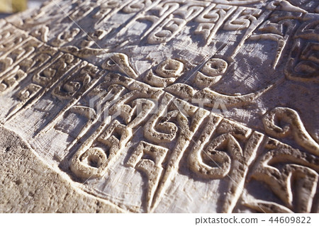 Buddhist religious symbols inscriptions in Tibet old runes 44609822