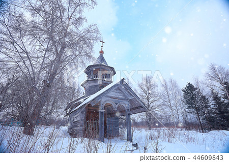 wooden church in the forest winter / landscape christian church in the winter landscape, view of the wooden architecture in the north 44609843