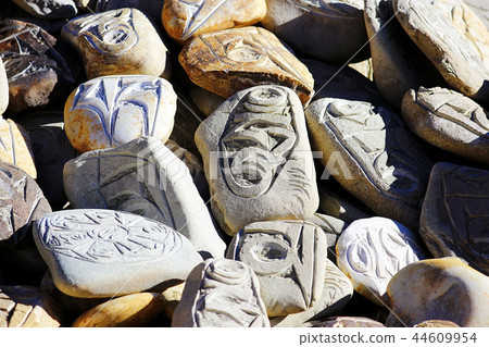 Buddhist religious symbols inscriptions in Tibet old runes 44609954