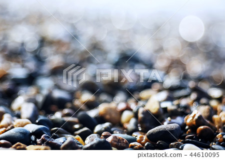 Pebble texture on the river bank 44610095