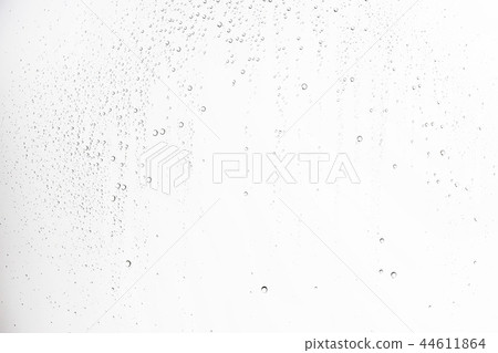 white isolated background water drops on the glass / wet window glass with splashes and drops of water and lime, texture autumn background 44611864