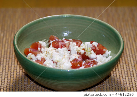 A chopped nagatake mushroom with a tuna pile 44612286