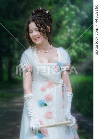 Happy woman musician in white dress with a flute Happy woman musician in white dress with a flute 44618160