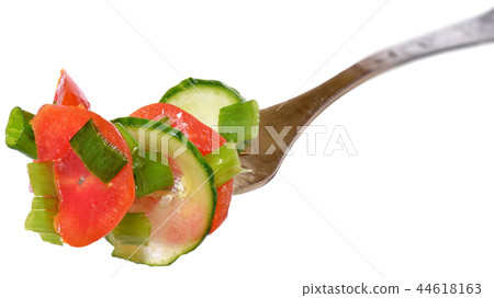 Fork with salad vegetables isolated Fork with salad vegetables isolated 44618163