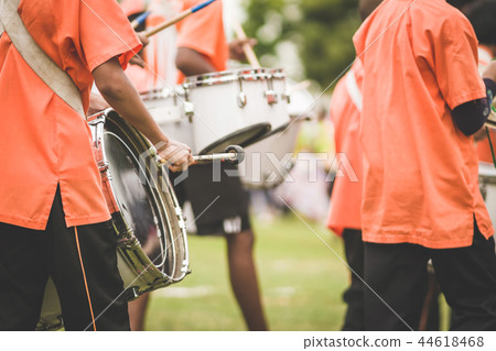 Marching band drummers perform in school parade Marching band drummers perform in school parade 44618468
